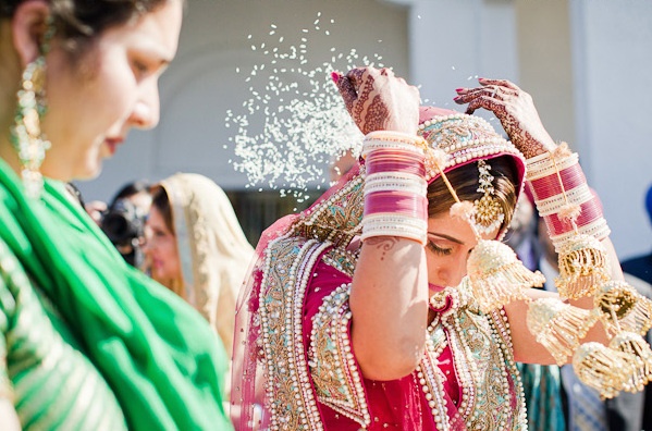 Indian Bride Throws Rice During Her Vidai